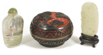 A Chinese contemporary carving of a dragon tablet on standtogether with a contemporary cinnabar