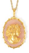 A large contemporary gold and diamond cameo style portrait pendant mounted on rose quartzthe 9ct