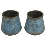 A pair of early Persian turquoise enamel on copper beakersof tapered squat form, each finely