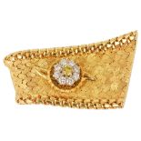 A good quality Continental fancy yellow diamond cluster 'ribbon' lapel pincirca 1970, formed as an