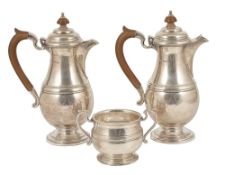 A Mappin and Webb silver suite, Sheffield 1939two hot water pots, with wood effect finial and