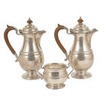 A Mappin and Webb silver suite, Sheffield 1939two hot water pots, with wood effect finial and