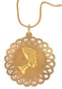 A large Continental 18ct gold 'Nefertiti' pendant on chainthe large pierced circular pendant applied