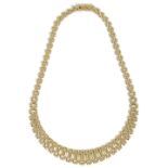 A ladies elegant graduated polished woven link 9ct gold necklacefully marked on push fastening