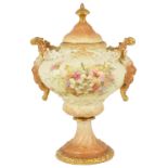 A Rudolstadt porcelain pedestal urn with cover, early 20th centurythe blush ivory coloured painted