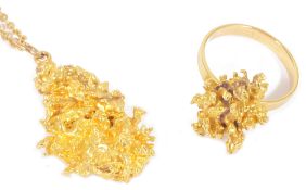 A yellow metal 'gold nugget' pendant and matching ringthe nugget testing for gold and suspended from