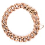 An Edwardian 9ct rose gold hollow curb link braceletof large link form, having 'invisible' push