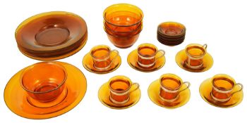 An early 20th century Chinese Peking amber glass tea service, circa 1920the six glass beakers with