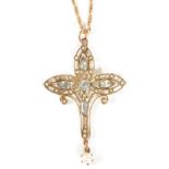 An Edwardian gold mounted aquamarine and pearl scroll pendant cross the pierced 9ct gold cross set