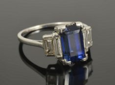 An Art Deco blue gem stone (synthetic sapphire) and diamond set ring