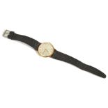 An Omega 14ct gold gentleman's wristwatchwith black and gold baton hours, index hands, Omega logo on