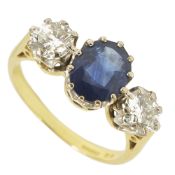 A large three stone sapphire an diamond set ringthe central oval sapphire of pleasing colour