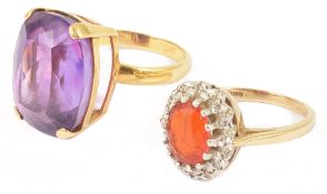 A large Continental 18K gold mounted oval amethyst ringtogether with a 9ct gold mounted oval fire