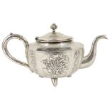 A Chinese export silver teapot by Chicheong, circa 1890of European shape and raised on three tusk