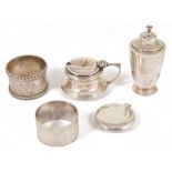 A small selection of silver comprising napkins rings, condiments and compactThe circular hinged