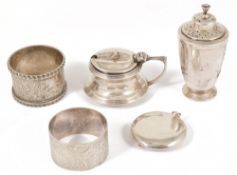 A small selection of silver comprising napkins rings, condiments and compactThe circular hinged