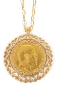 An Edward IIV fine gold sovereign, 1903in 9ct gold heart motif pendant mount and suspended on a