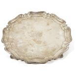 A George V silver pie crust salver, Sheffield 1926of typical form with flared stepped border