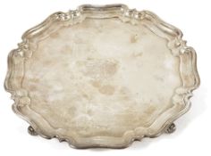 A George V silver pie crust salver, Sheffield 1926of typical form with flared stepped border