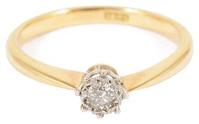 A delicate single stone diamond set ringin yellow and white 18ct gold fancy set mount, diamond