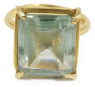 A large Continental rectangular green gem set dress ring, the emerald cut stone of bluish green