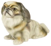 An Austrian Goldscheider King Charles Spaniel figurine, modelled seated on its hind legs, factory