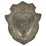 A Chinese export silver embossed heart shaped plaquewith central heart surrounded by branches and