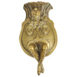 An amusing Victorian brass gas wall cigar lighter, formed as a jester smoking a cigar, push action