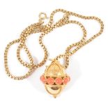 A contemporary gold and coral set pendant on chainthe yellow metal orb pierced with central row of