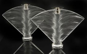 A pair of Lalique 'Ravelana' candle holders, 20th century,moulded pressed crystal with palm