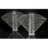 A pair of Lalique 'Ravelana' candle holders, 20th century,moulded pressed crystal with palm