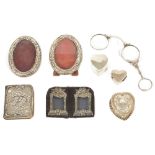 A selection of silver miniature frames and boxes etccomprising a pair of oval silver miniature