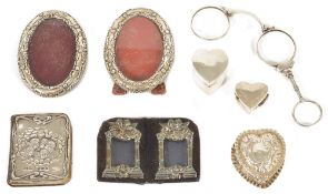 A selection of silver miniature frames and boxes etccomprising a pair of oval silver miniature