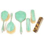 An Art Deco five piece silver and enamel dressing table setthe brushes and mirror with silver and
