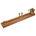 An Antique Cotton Mill Yarn tester by JH Heal Maker Halifaxthe mahogany base with brass inch ruler