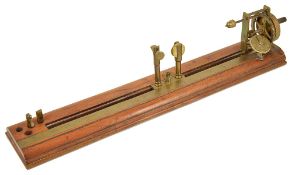 An Antique Cotton Mill Yarn tester by JH Heal Maker Halifaxthe mahogany base with brass inch ruler