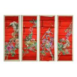 A set of four Chinese red silk wall hangings, 20th centuryeach embroidered with colourful flower