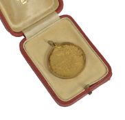 A John Pinches silver gilt 'Mother's Day 1975' pendant,decorated with horse and foal on one side and