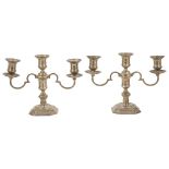 A pair of Elkington & Co. silver candlesticks, Birmingham 1967with three candle sconces with