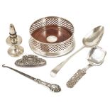 A selection of silver, bottle coaster, bottle stopper, spoons, button hookthe Mappin & Webb circular