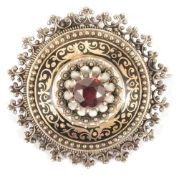 A late 19th Century Austro-Hungarian garnet and enamel broochthe circular target brooch raised