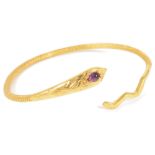 A contemporary 18ct gold woven snake banglethe serpent's head set with a single tear shaped cabochon