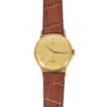 An Omega 14K gold gentleman's wristwatchthe circular champagne coloured dial with baton hours with