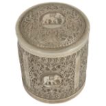 A 19th century Indian silver cylindrical box with coverwith decorated repousse panels, with