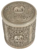 A 19th century Indian silver cylindrical box with coverwith decorated repousse panels, with