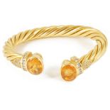 An attractive Continental 18ct gold yellow gem and diamond twist torque banglethe open ended