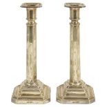 A pair of Edwardian silver candlesticks, Sheffield 1907of octagonal columnar form with stepped base,