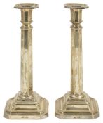 A pair of Edwardian silver candlesticks, Sheffield 1907of octagonal columnar form with stepped base,