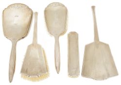 Five Art Deco silver dressing table brushes/mirrors, Birmingham 1932comprising two brushes and a