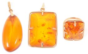 A large Russian modernist design gold mounted reconstituted amber ringtogether with a matching